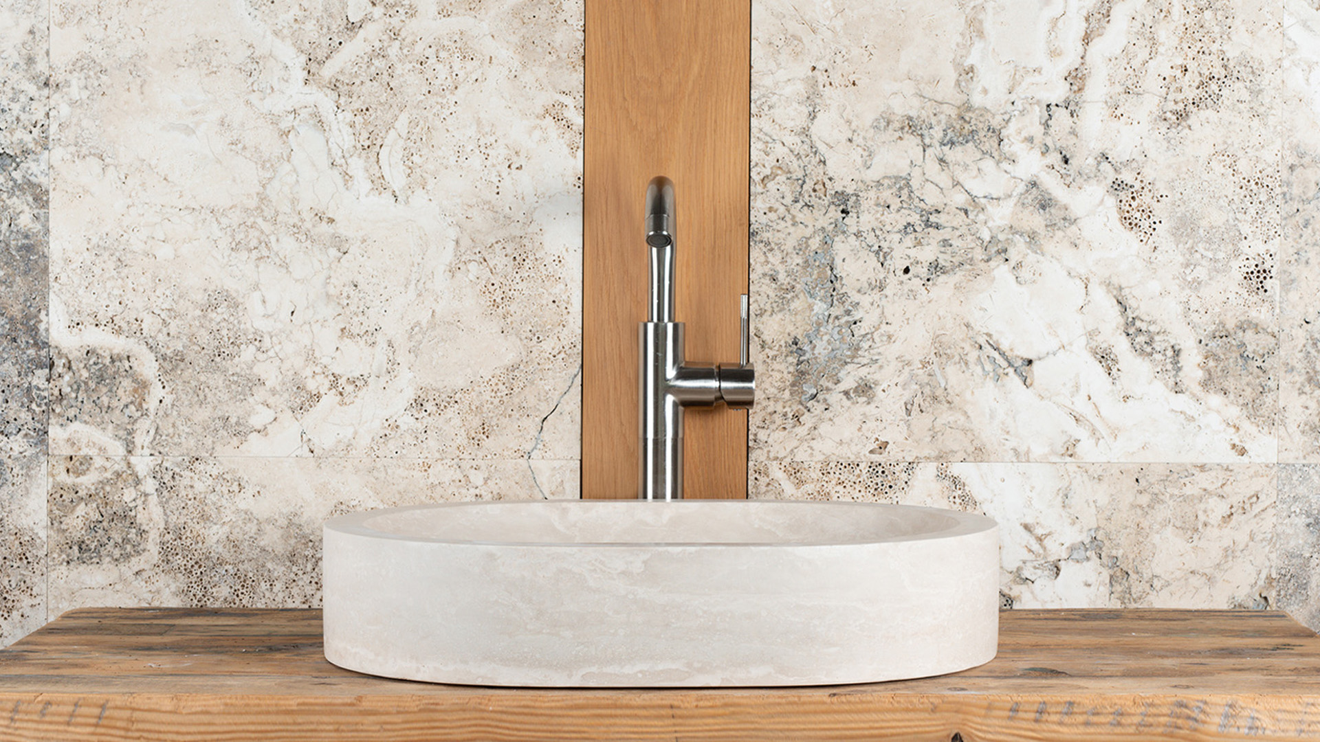 Oval travertine washbasin “Soap”